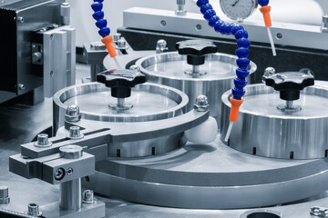 A modern CNC metalworking machine for grinding metal parts.