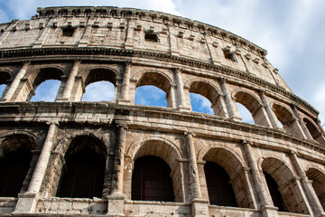 The famous Colosseum in Rome against the blue sky on a sunny May day