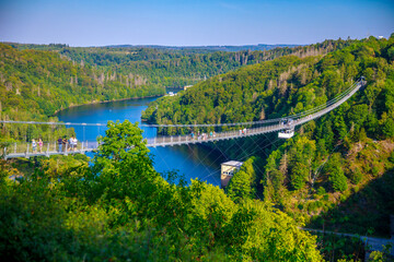 Pedestrian suspension bridge above Rappbodetalsperre lake and Rappbode River in Harz Mountains...