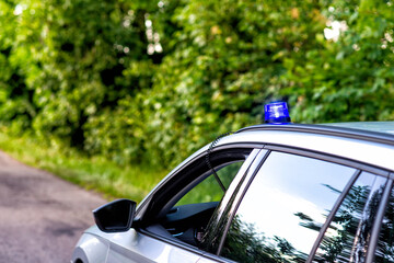 blue flashing light on a police car