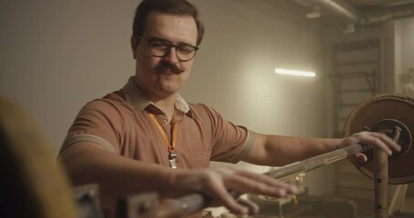 Weightlifting Coach Struggles with Barbell in Old-School Gym