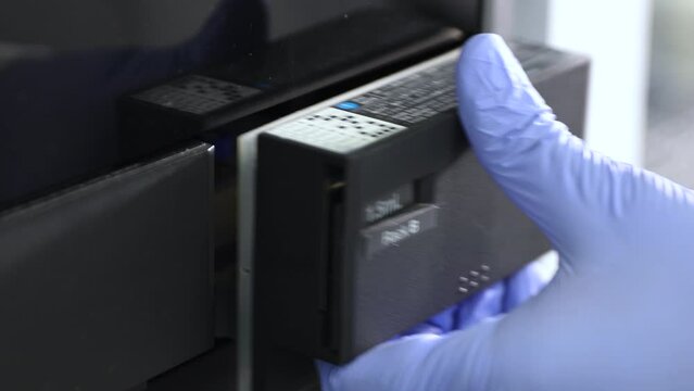close up of science experiment Vials filling inside an autosampler of an HPLC machine inside view in a Scientific experimental laboratory for research development analysis and clinical trial study	
