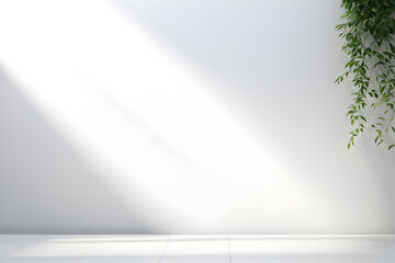 Sunlight streaming on a blank wall with green foliage—ideal for serene backgrounds