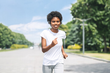 Happy African American Couple Jogging Outdoor In City Park. Morning Run Concept. Copy Space