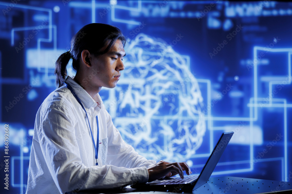 Fototapete Trained technician in data center uses artificial intelligence computing simulating human brain through self learning algorithms. Knowledgeable expert with laptop working with AI deep neural networks