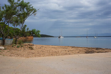View from the beach on the island of Vrgada in Croatia during a cloudy summer day
