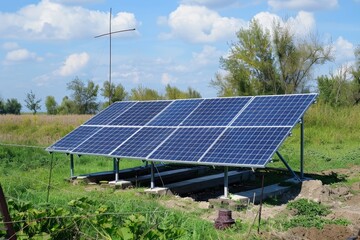 Solar panels and tube well for watering crops in fields