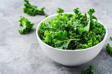 Vegan kale chips in white bowl Healthy concept