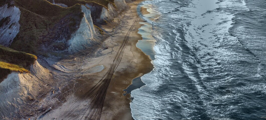White rocks on the coast of the Sea of Okhotsk in Iturup Island, Kuril Islands,Russia . Aerial view.