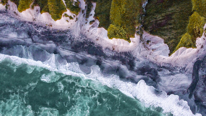 White rocks on the coast of the Sea of Okhotsk in Iturup Island, Kuril Islands,Russia . Aerial view.