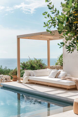 Outdoor pool area with modern furniture, surrounded by garden with plants and trees, overlooking the sea