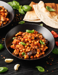 Eggplant and Chickpea Stew in tomato sauce, garlic, spices and pita bread. Healthy food
