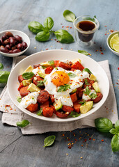 Sweet Potato and Chorizo Hash with egg, avocado and herbs.