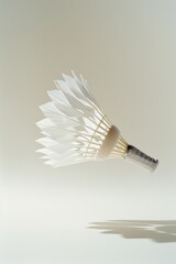 A white badminton ball in mid-air, ready for a game or competition