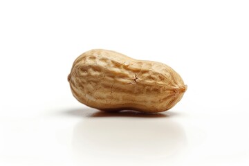 Obraz premium A single peanut sitting alone on a white surface