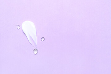 Sample of cosmetic cream and gel on lilac background