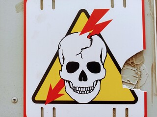 Warning sign with a skull in the center of the image. The concept of danger.