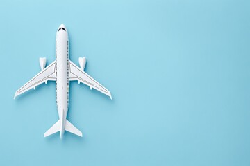 White Airplane Model on Pastel Blue Background