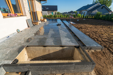 Ceramic terrace tiles on adjustable supports under construction. Elevated exterior floor build...