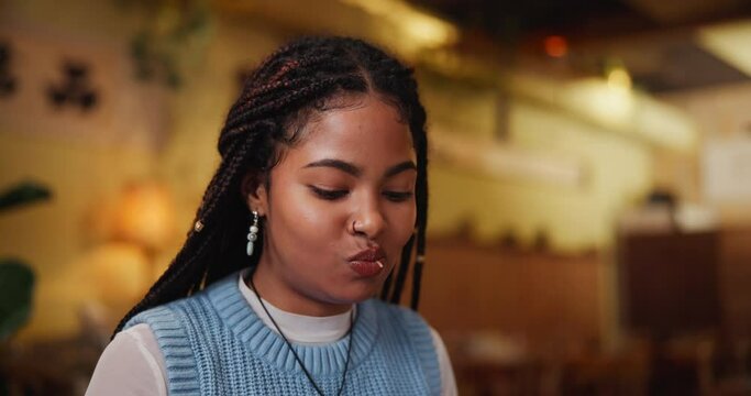 Black girl, chopsticks and seafood in restaurant while eating asian food for brunch with satisfaction. African woman, hashi and customer in sushi bar for lunch and dinner with health or protein diet