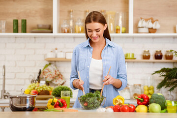 Healthy Eating. Woman Mixing Fresh Salad In Kitchen, Cooking Dinner