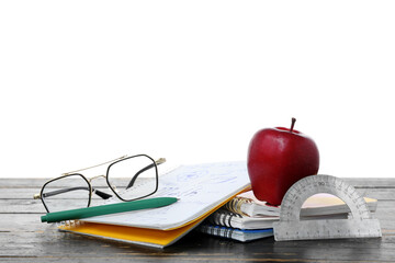 Red apple and school supplies with eyeglasses and protractor on table against white background