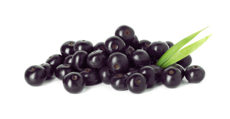 Fresh ripe acai berries and green leaves isolated on white