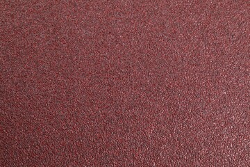Texture of coarse sandpaper as background, top view