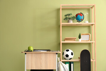 Interior of classroom with desk and shelf unit