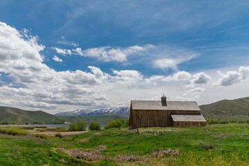 Wooden barn on ranch farmland. Midway, Utah, United States of America. © Zenstratus