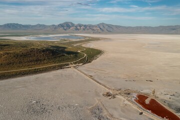 Sandy shoreline and Dirty brown lake in The Great Salt Lake  Corinne, Utah, United States of...