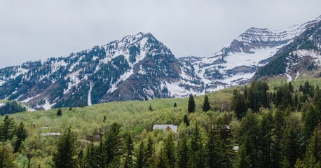Spring trees, mountain range and houses  in Sundance, Utah, United States of America.