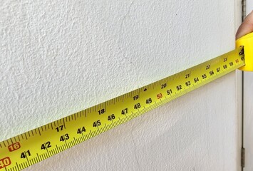 Length Measuring Tape on Concrete Wall.