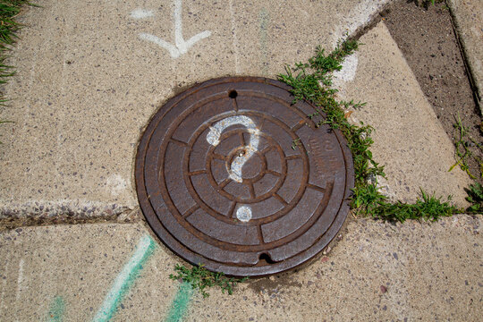 Manhole with Question Mark Storm Drain Utility Sewer Water Pipes Access  