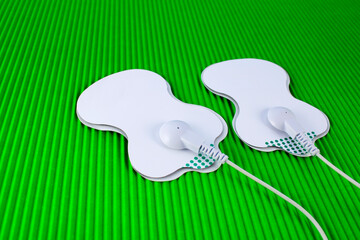 TENS, two connected body electrostimulators