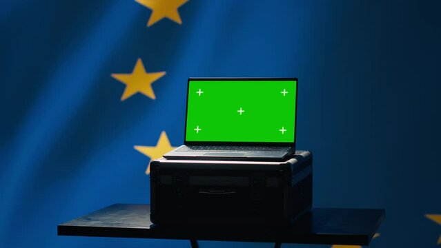 EU alliance engineer uses green screen laptop to protect against fake accounts on social media. Technician doing cybersecurity job for European Union with mockup notebook, camera A