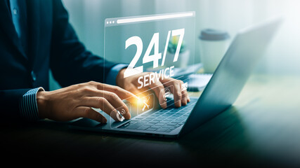Businessman Providing 24/7 Online Support Service Through Laptop with Digital Interface Hologram Displaying Various Customer Assistance Icons, Representing Constant Availability