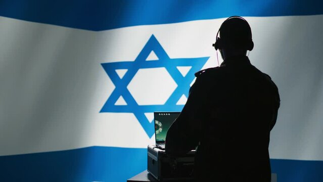 Israeli air defense command operator conscript using radar system on laptop to detect incoming ballistic missiles. IDF army soldier scanning rockets approaching borders, deploying shields, camera B