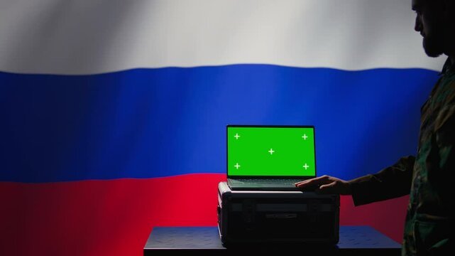 Russian ex KGB FSB service using radar on green screen laptop to detect missiles attacking borders. Moscow regime army using mockup device to scan approaching rockets, deploying shields, camera B