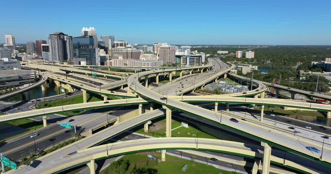 Orlando, Florida. View from above of American big freeway intersection with fast moving cars and trucks. USA transportation infrastructure concept.