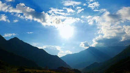 Beautiful landscape mountain green field grass meadow white cloud blue sky on sunny day. Majestic green scenery big mountain hill cloudscape valley panorama view in countryside greenery pasture