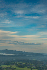 Vertical Beautiful Mountain landscape foggy windy mountain range green landscape asian farm. Vertical Amazing Landscape mountain green field meadow white cloud blue sky sunrise. Countryside scenery