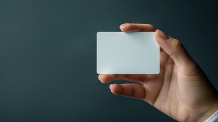 Blank credit card mockup in hand on clean background, shopping in store, transaction at terminal, secure payment, financial services advertising