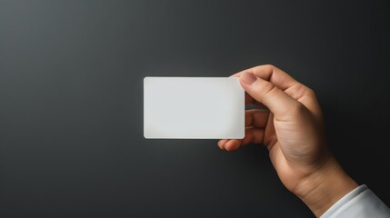 Blank credit card mockup in hand on clean background, shopping in store, transaction at terminal, secure payment, financial services advertising