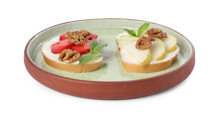 Delicious bruschettas with ricotta cheese, pear, strawberries, mint and walnuts isolated on white