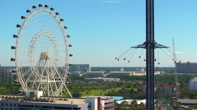 Orlando Starflyer swing ride and Ferris wheel. Attraction for tourists on International Drive in Orlando, Florida. USA travel destination