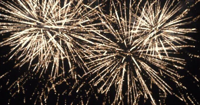 Blurred background Golden Firework celebrate anniversary happy new year 2025, 4th of july holiday festival. Blurry gold firework night time celebrate national holiday. Countdown to new year 2025 festi