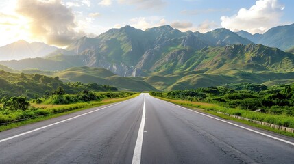 Naklejka premium Asphalt highway and green mountains with cloudy sky at sunset