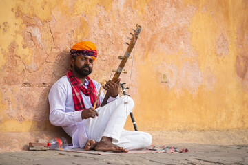 Picture of a Rajasthani artist playing violin on street. Jaipur, Pushkar, Jodhpur, Jaisalmer,...