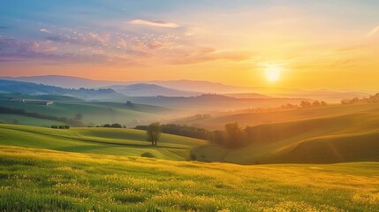 Obraz premium A scenic view of rolling hills at sunset.